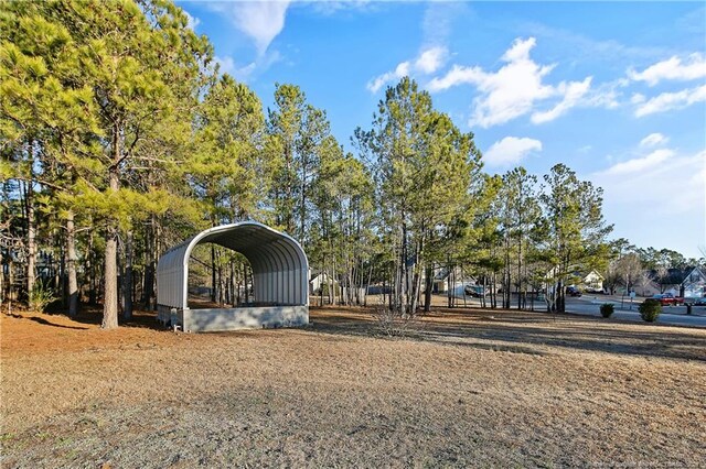 255 Heartwood Dr, Raeford, NC 28376 - exterior space with a carport