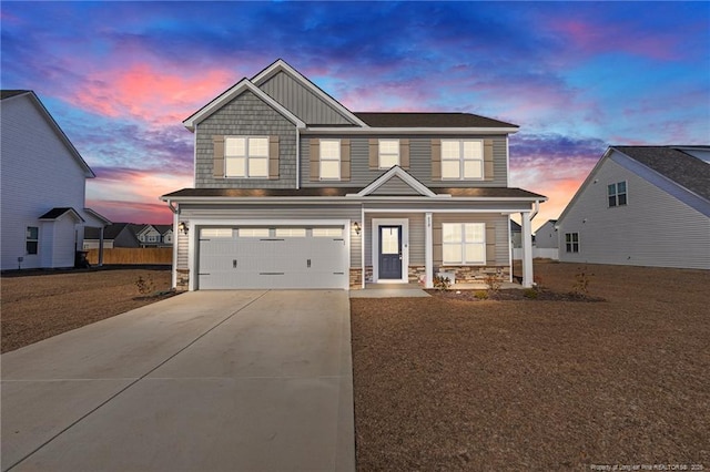 view of front of property with a garage