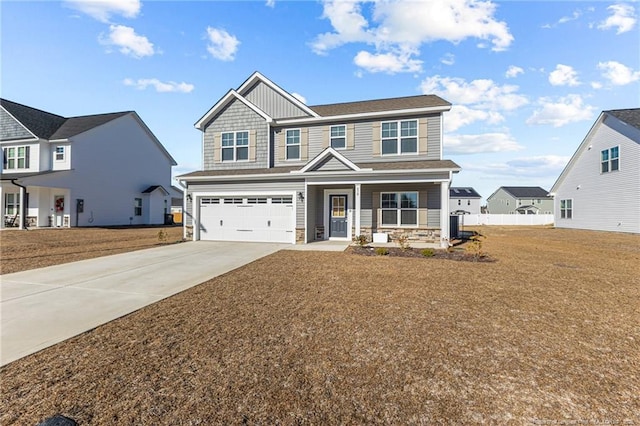 craftsman house featuring a front yard, a garage, and a porch