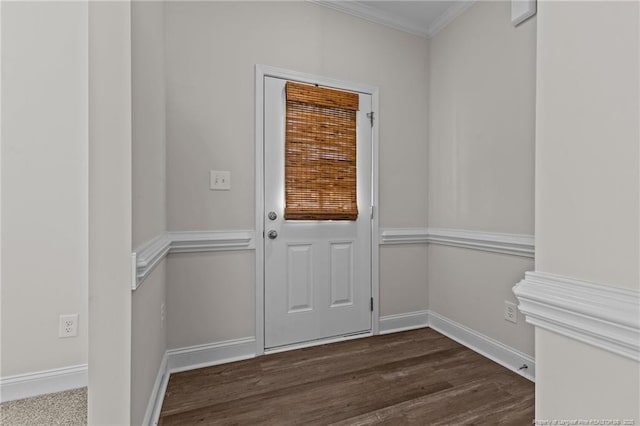 doorway to outside with dark hardwood / wood-style flooring and ornamental molding