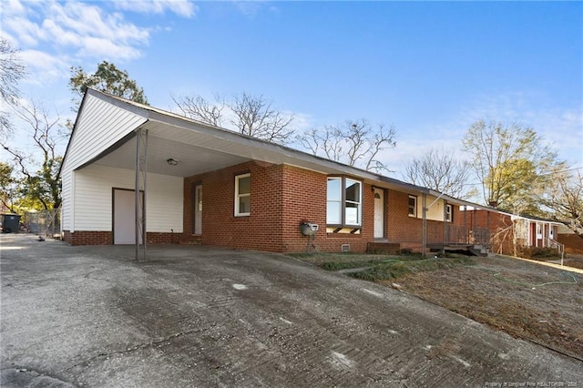 view of front of home featuring a carport