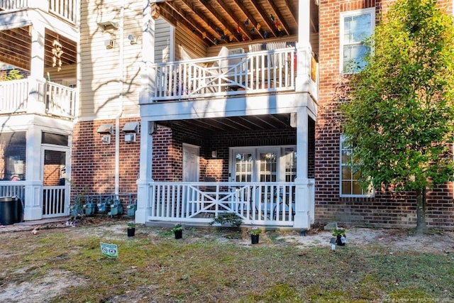 back of property with a balcony