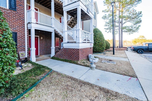 view of side of property featuring a balcony