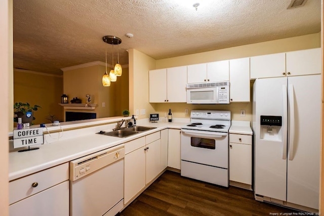 kitchen with white cabinetry, sink, white appliances, and hanging light fixtures