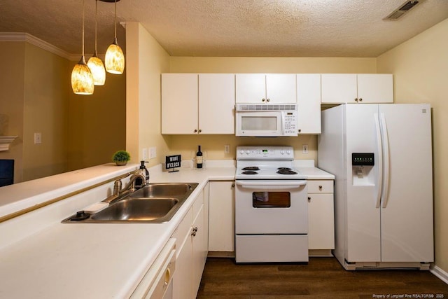 kitchen with a textured ceiling, sink, white cabinets, and white appliances