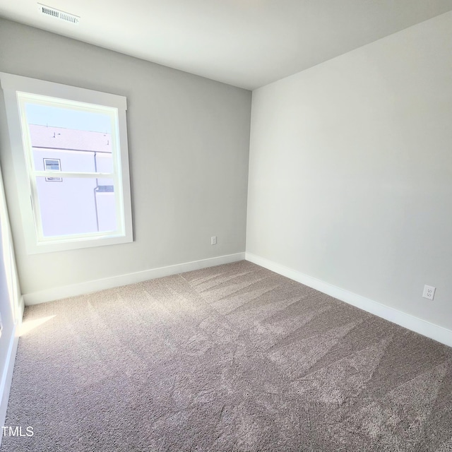 unfurnished room with carpet floors