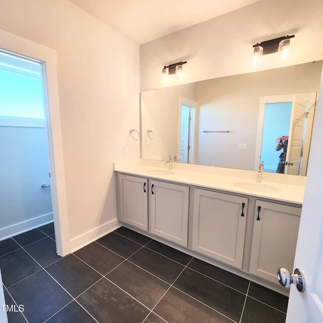 bathroom with vanity and tile patterned flooring