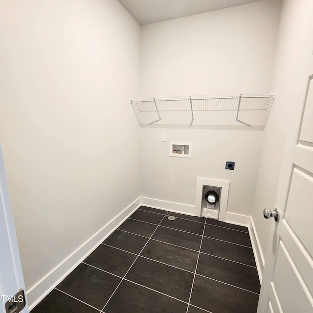 laundry area with washer hookup, hookup for an electric dryer, and dark tile patterned floors