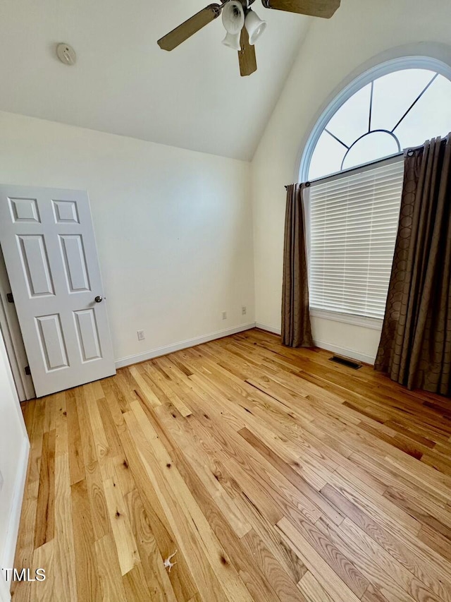 interior space featuring ceiling fan, light hardwood / wood-style flooring, and vaulted ceiling