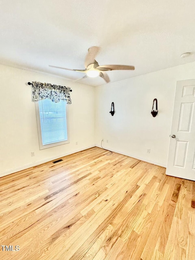 spare room featuring light hardwood / wood-style floors