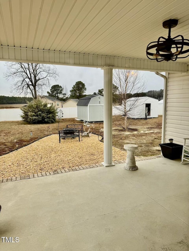 view of patio / terrace featuring ceiling fan and a shed