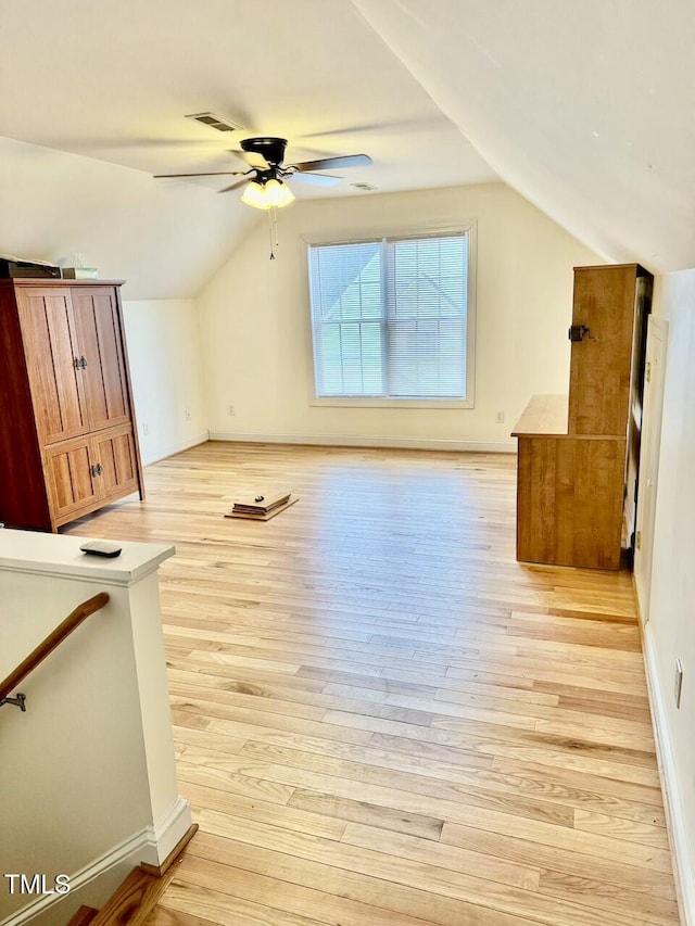 bonus room with ceiling fan, lofted ceiling, and light hardwood / wood-style flooring