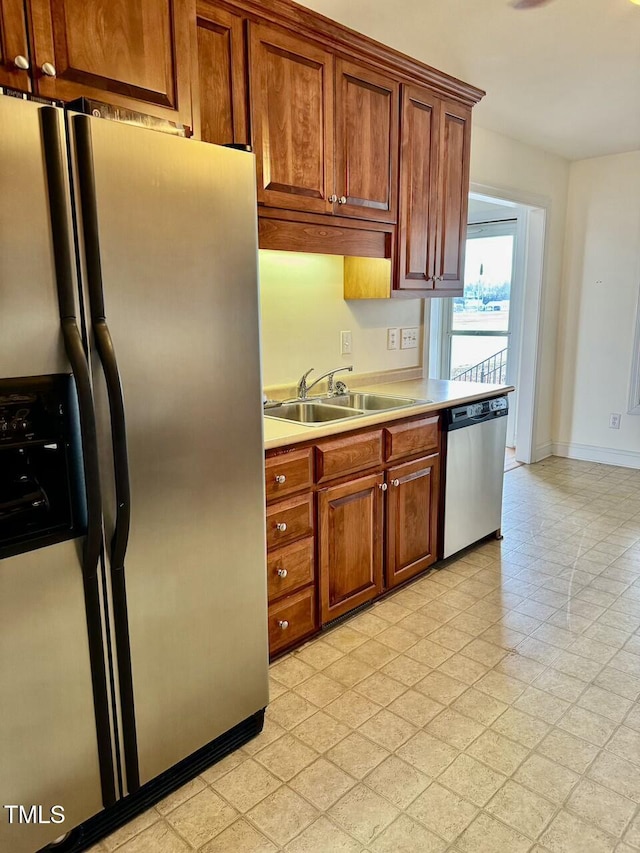 kitchen featuring stainless steel appliances and sink