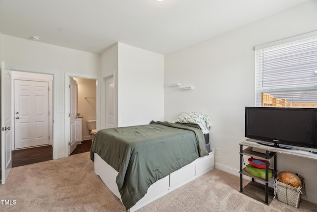 115 Bourne Dr, Franklinton, NC 27525 - carpeted bedroom with baseboards and ensuite bathroom