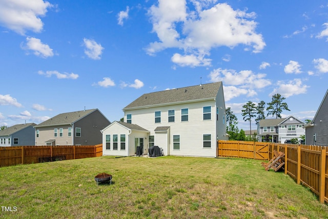 115 Bourne Dr, Franklinton, NC 27525 - rear view of property featuring a fire pit and a residential view