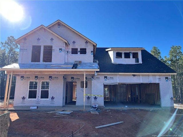 property in mid-construction with covered porch