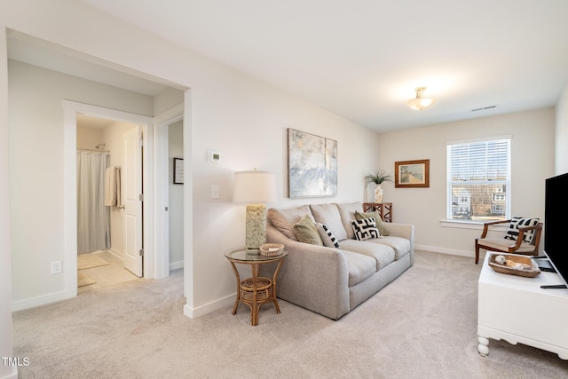 living room with light colored carpet