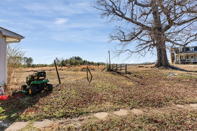 view of yard with a rural view