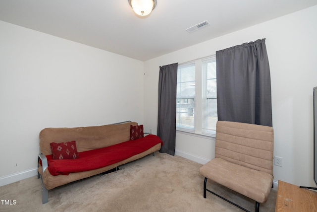 living area with light colored carpet