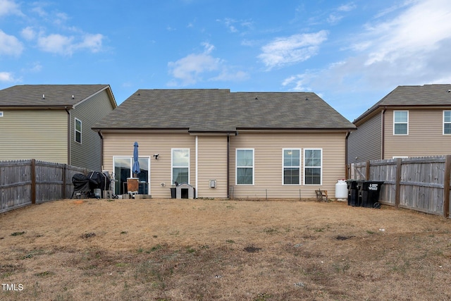 back of house with a yard