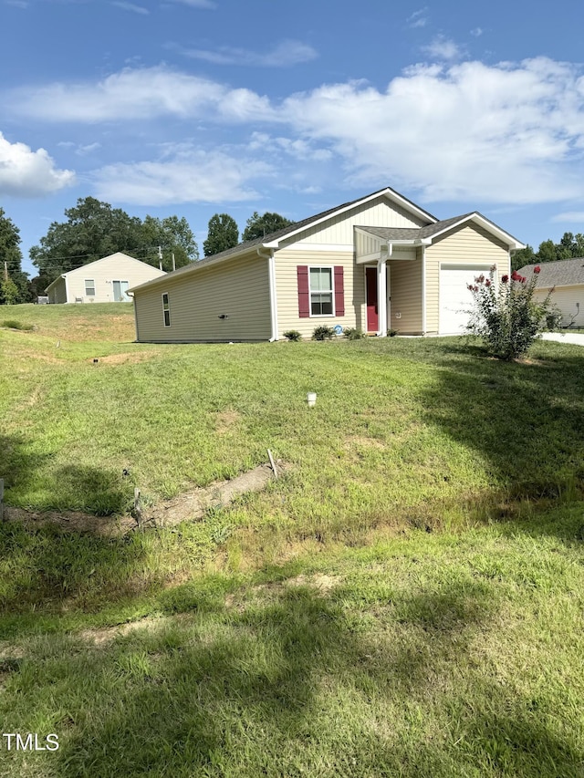 single story home featuring a garage and a front yard