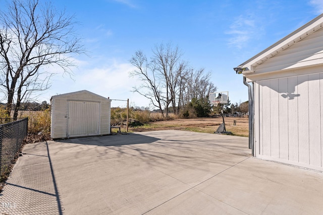 view of patio featuring a storage unit