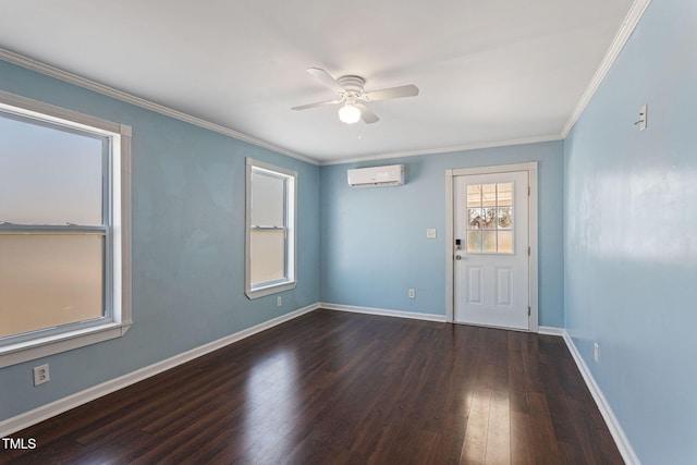 empty room featuring a wall unit AC, ceiling fan, dark hardwood / wood-style flooring, and crown molding