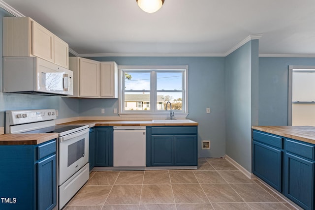 kitchen featuring crown molding, sink, blue cabinetry, and white appliances