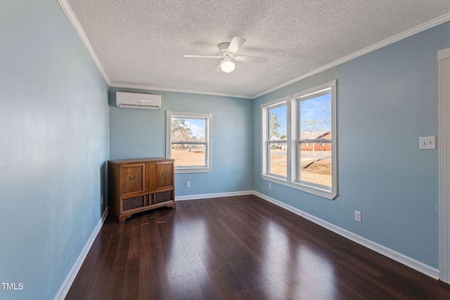 unfurnished room with an AC wall unit, dark wood-type flooring, and ornamental molding