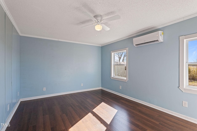 spare room with dark wood-type flooring, crown molding, an AC wall unit, and ceiling fan