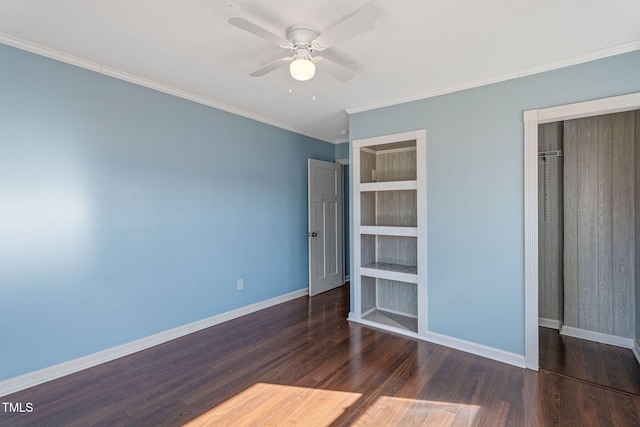 unfurnished bedroom featuring a textured ceiling, dark hardwood / wood-style floors, a closet, ornamental molding, and ceiling fan