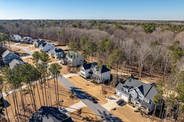 aerial view with a residential view and a wooded view