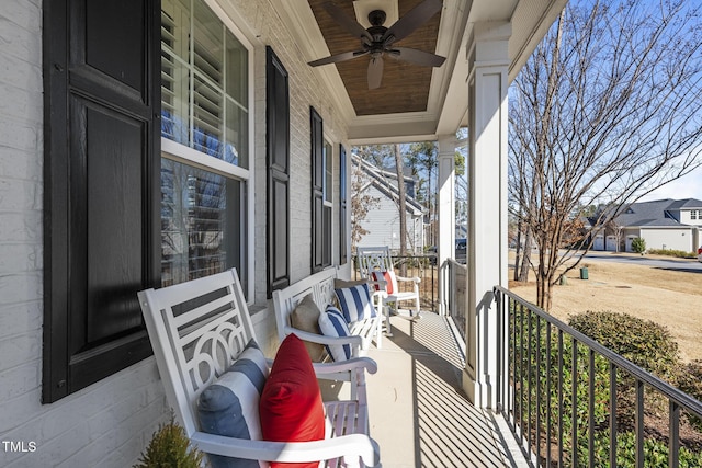 balcony featuring a ceiling fan and covered porch