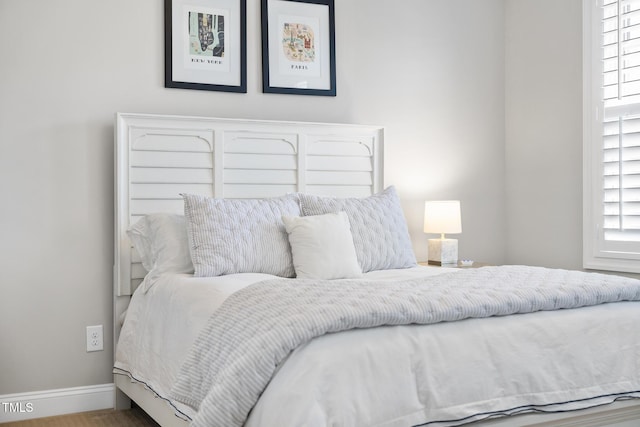 bedroom featuring baseboards