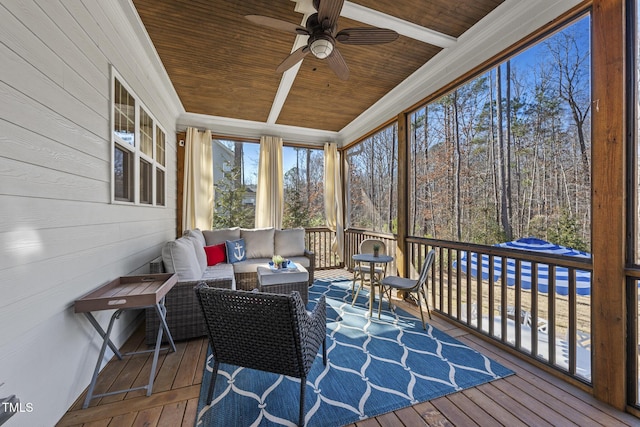 sunroom / solarium featuring wooden ceiling and a ceiling fan