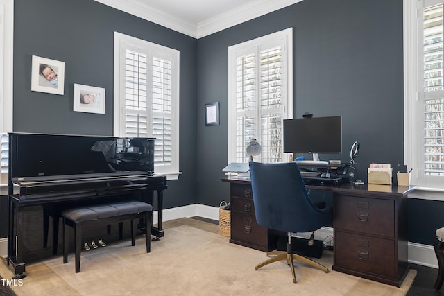 office featuring carpet, baseboards, ornamental molding, and a wealth of natural light