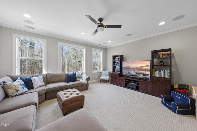 living room featuring carpet, ornamental molding, plenty of natural light, and baseboards