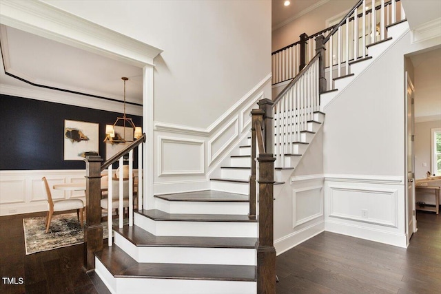1141 Barley Stone Way, Raleigh, NC 27603 - stairs featuring a decorative wall, a chandelier, wood finished floors, crown molding, and a wainscoted wall