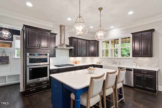 1141 Barley Stone Way, Raleigh, NC 27603 - kitchen featuring wall chimney exhaust hood, stainless steel appliances, light countertops, dark wood finished floors, and recessed lighting