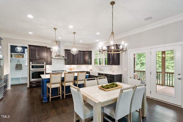 1141 Barley Stone Way, Raleigh, NC 27603 - dining space featuring a chandelier, dark wood-style flooring, crown molding, and recessed lighting