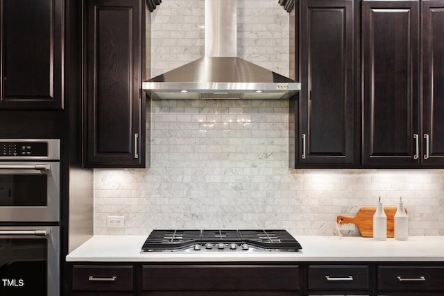 1141 Barley Stone Way, Raleigh, NC 27603 - kitchen with wall chimney exhaust hood, appliances with stainless steel finishes, decorative backsplash, and dark brown cabinets