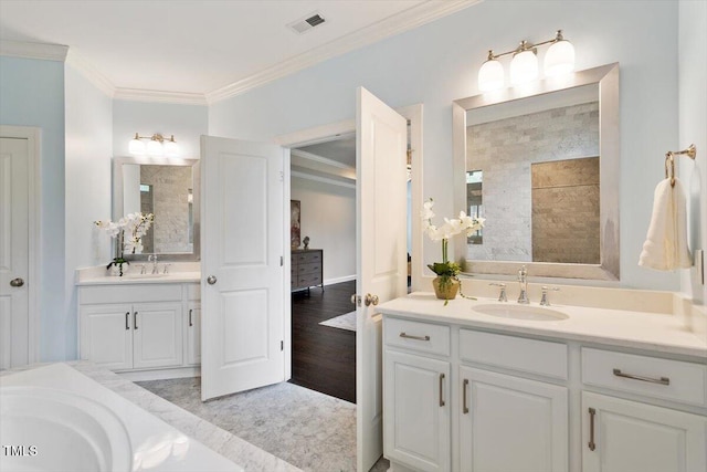 1141 Barley Stone Way, Raleigh, NC 27603 - bathroom with ornamental molding, two vanities, a tile shower, and wood finished floors