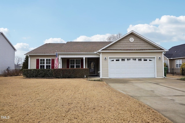 view of front of house featuring a garage and a front yard