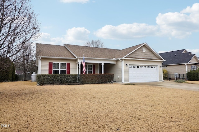 ranch-style home with a garage and a front yard