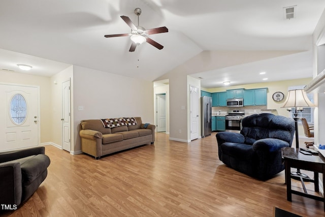 living room featuring lofted ceiling, light hardwood / wood-style flooring, and ceiling fan