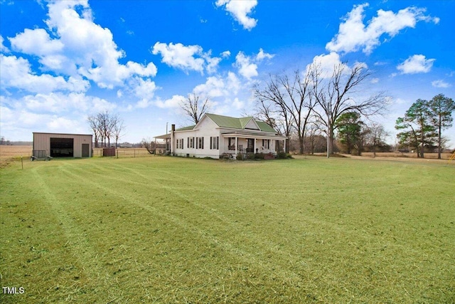 view of yard with an outdoor structure