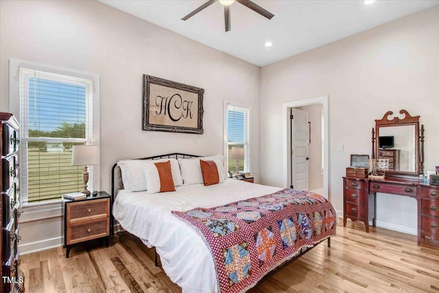 bedroom with light wood-type flooring and ceiling fan