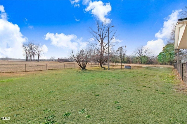 view of yard with a rural view