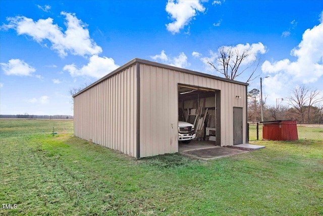 view of outbuilding featuring a yard