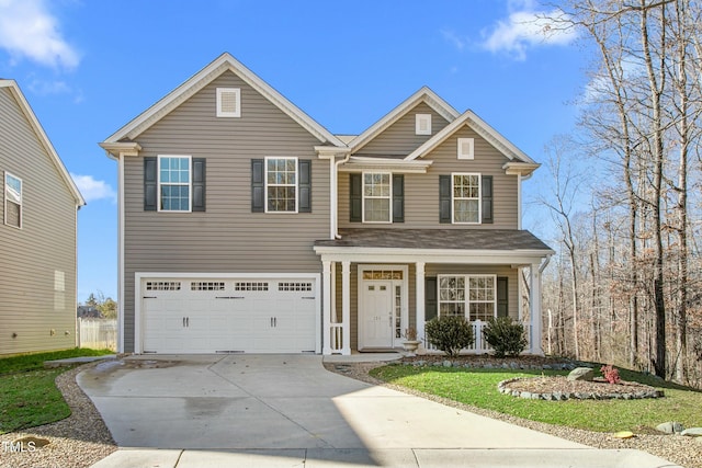 view of front of house with a garage and a front lawn